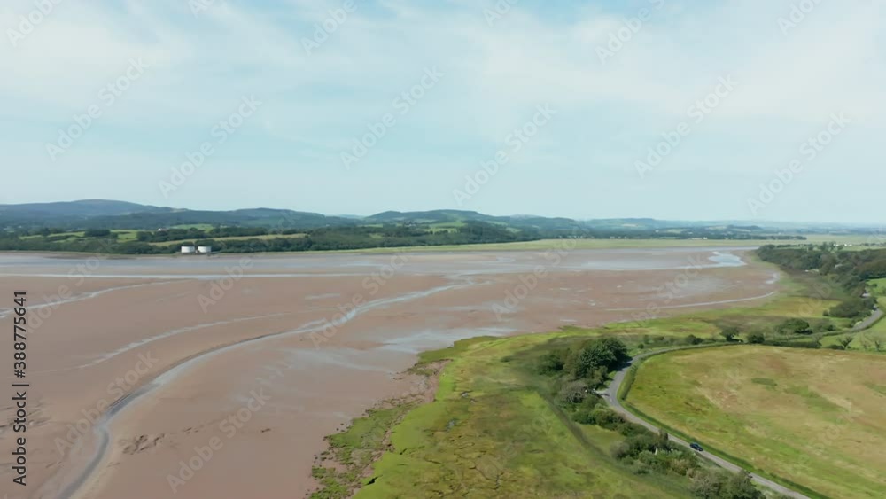 Aerial Landscape View of the Skyline over a Vast Sand and Grassland Aerial Landscape View of the Skyline over a Vast Sand and Grassland