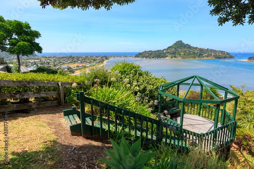 The town of Tairua, New Zealand, seen from a public lookout gazebo. Across the harbor is Mount Paku