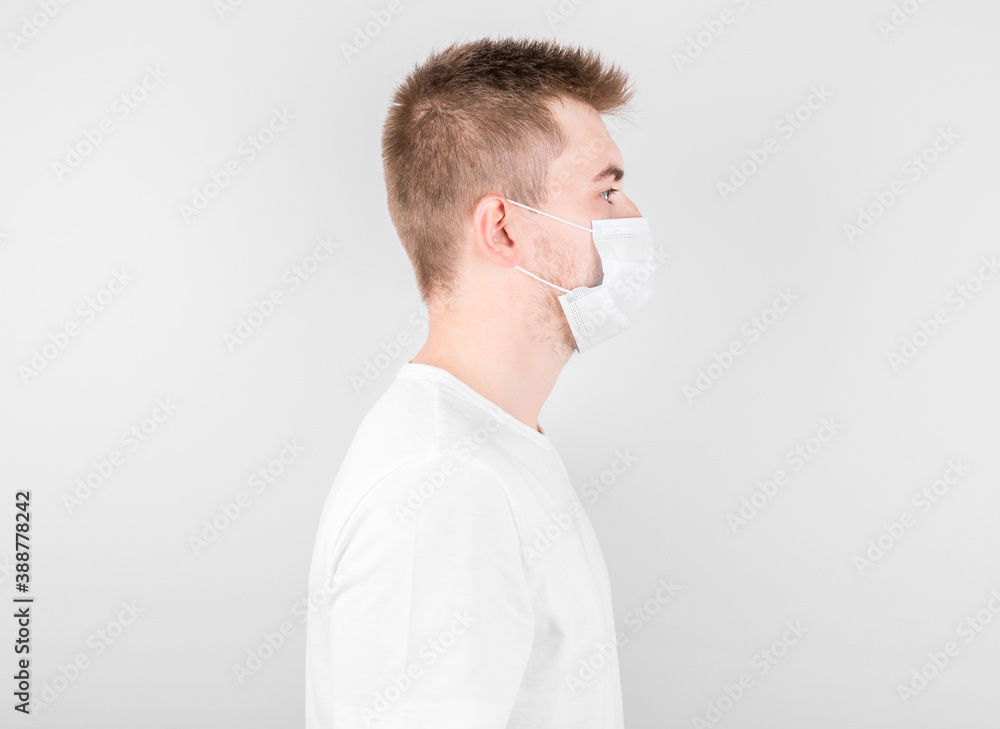 Man wearing hygienic mask to prevent infection, airborne respiratory illness such as flu, 2019-nCoV. indoor isolated on white background Man wearing hygienic mask to prevent infection, airborne respiratory illness such as flu, 2019-nCoV. indoor isolated on white background