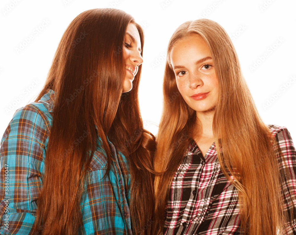 two cute teenagers having fun together isolated on white two cute teenagers having fun together isolated on white