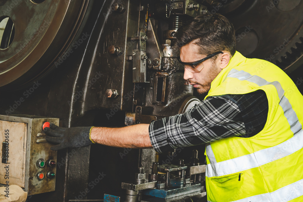 A factory engineer works in the factory metalwork. A factory engineer works in the factory metalwork.