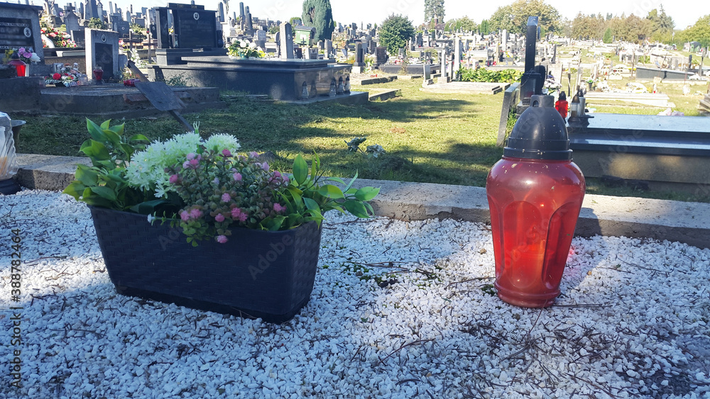 red lantern and flowers on grave at christian cemetery red lantern and flowers on grave at christian cemetery