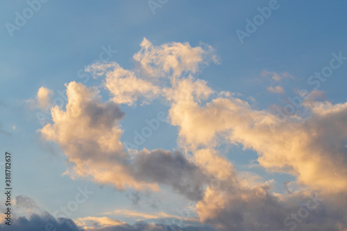 Dramatic clouds in the sky illuminated by the sun.