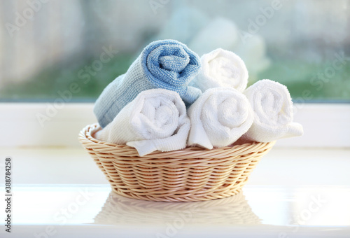 Rolled towels in basket closeup.Clean towel body care and hygiene concept.