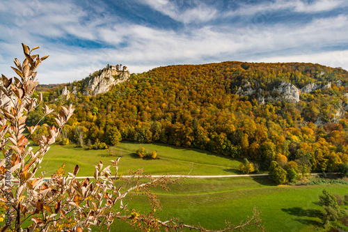 Colorful view of Bronnen Castle on the hiking trail in autumn in the Danube valley near Beuron photo