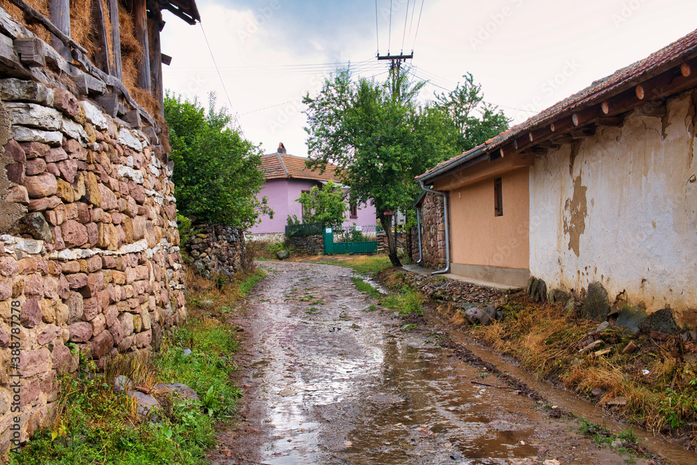 Old traditional village in Stara Planina mountains on a rainy summer day
