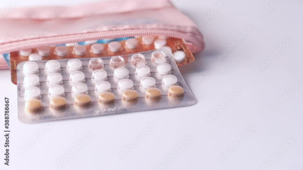 birth control pills on wooden background, close up birth control pills on wooden background, close up