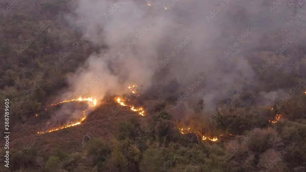 Aerial view of Wildfire filled with flames and toxic fumes from burning on mountains in northern Thailand. Aerial view of Wildfire filled with flames and toxic fumes from burning on mountains in northern Thailand.