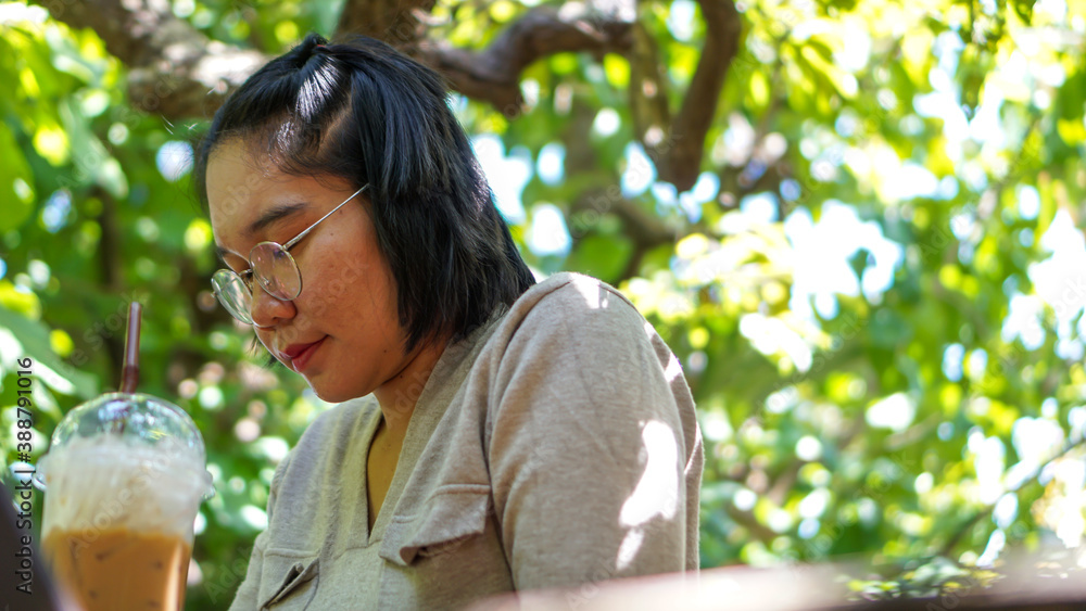 Asian women Thailand are relaxing in trees at nature Asian women Thailand are relaxing in trees at nature