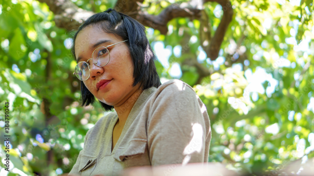 Asian women Thailand are relaxing in trees at nature Asian women Thailand are relaxing in trees at nature