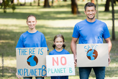 smiling family of activists holding placards with there is no planet b inscription, ecology concept
