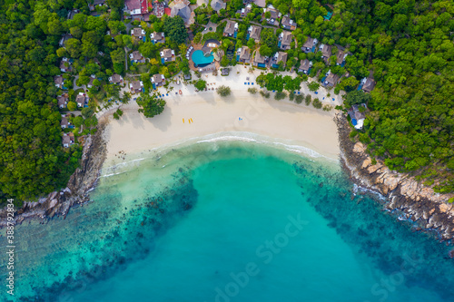 Tropical beach with turquoise ocean in paradise island. Aerial view. Paradise resort.