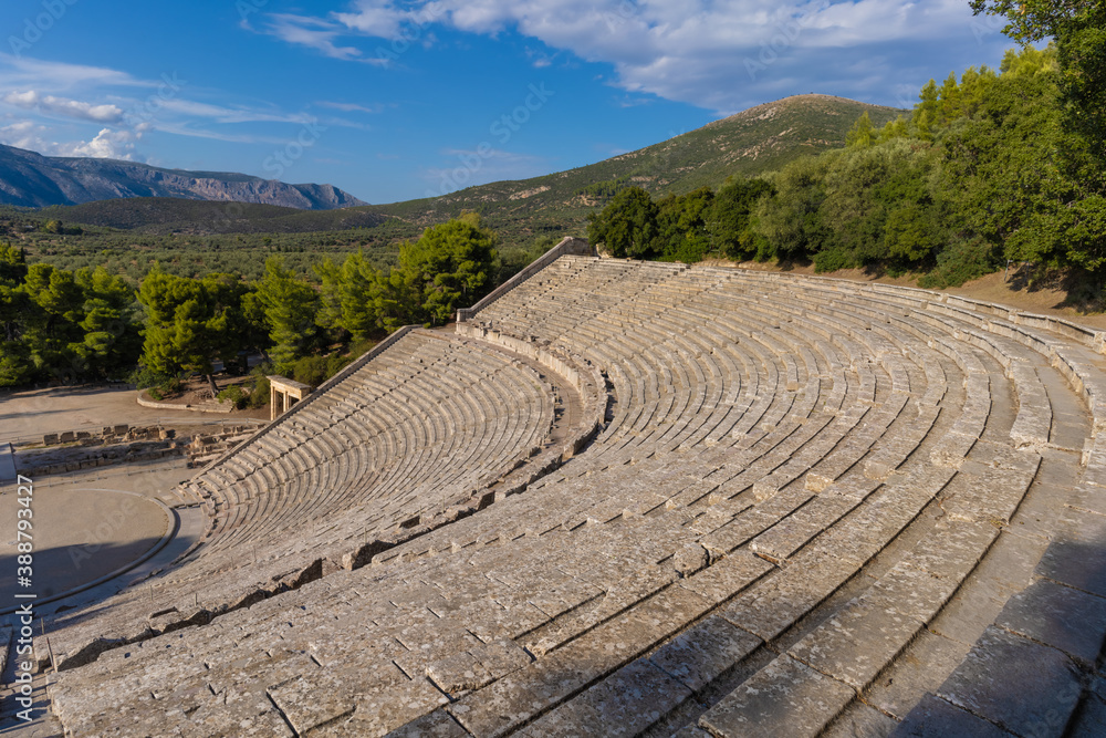 Ruins of the Ancient Theatre of Epidaurus located on the southeast end of the sanctuary dedicated to the ancient Greek God of medicine, Asclepius. Epidaurus, Peloponnese, Greece Ruins of the Ancient Theatre of Epidaurus located on the southeast end of the sanctuary dedicated to the ancient Greek God of medicine, Asclepius. Epidaurus, Peloponnese, Greece