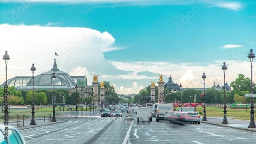 Avenue du Marechal Gallieni with traffic timelapse. Avenue du Marechal Gallieni connects Les Invalides (National Residence of Invalids) complex and Alexandre III Bridge. Paris, France photo