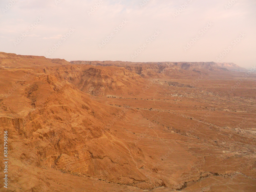Sunrise hike to the old ruins of the archeological site of Masada in Israel by the Dead Sea