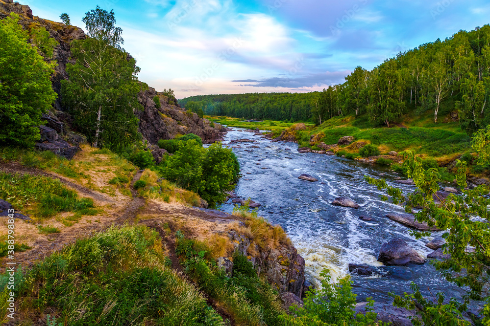 Many rapids with waterfalls, spray foam and whirlpools close-up, rotate camera. Ural region, Russia. The threshold Revun. Many rapids with waterfalls, spray foam and whirlpools close-up, rotate camera. Ural region, Russia. The threshold Revun.