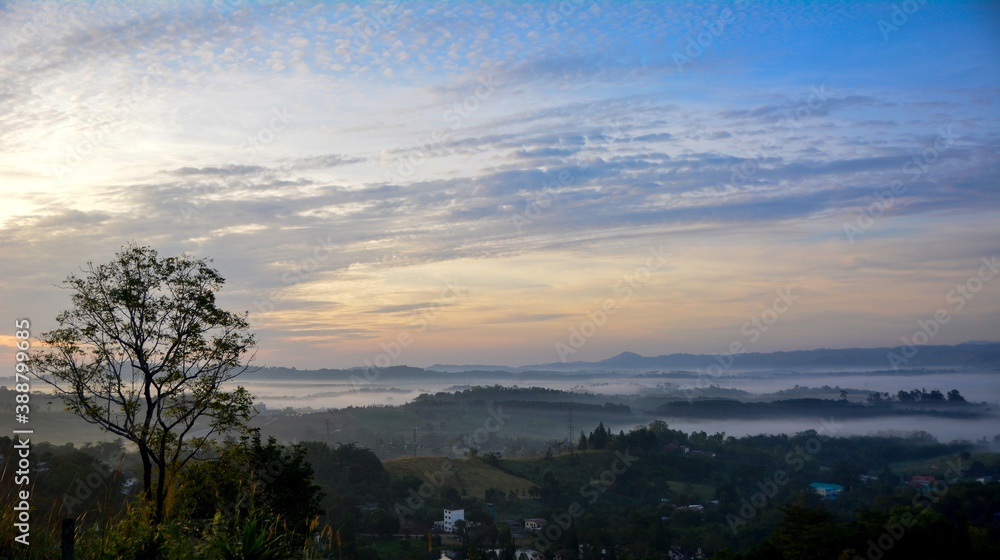 Beautiful Landscape of mountain layer in morning sun ray and winter fog Beautiful Landscape of mountain layer in morning sun ray and winter fog