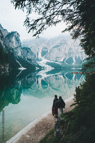 Couple looking out to a blue lake  © Jake