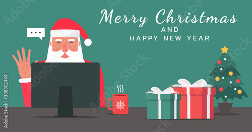 Santa Claus waving hand using a computer on the table with gifts and decorations and Merry Christmas and happy new year text, vector flat illustration