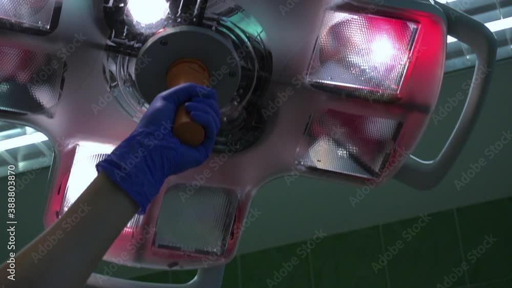 operating room. a gloved hand adjusts the operating lamp. Slow motion operating room. a gloved hand adjusts the operating lamp. Slow motion