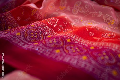 Red fabric in floral pattern as a background