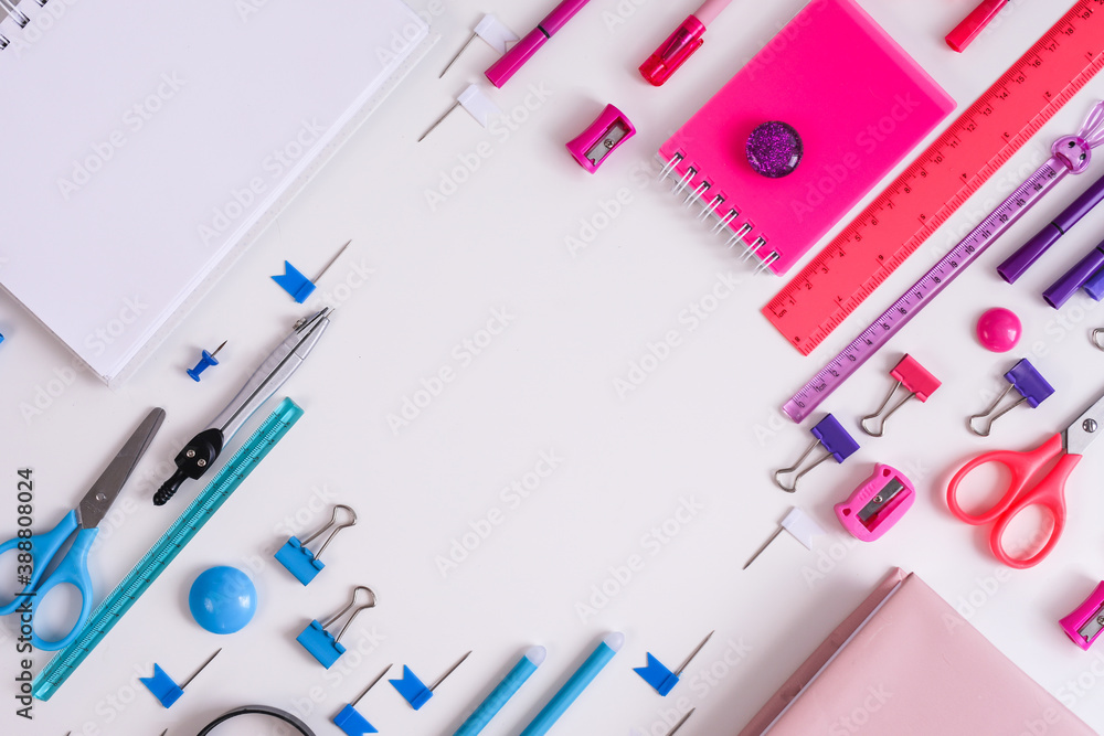 Pink notepad, pencil and marker on pink and blue background. Flat lay. Concept office and back to school. Pink notepad, pencil and marker on pink and blue background. Flat lay. Concept office and back to school.