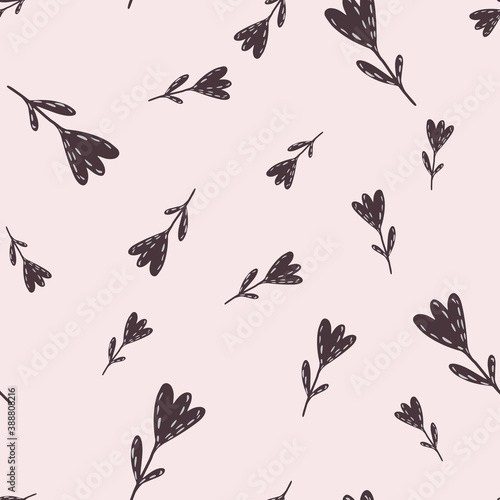 Seamless random pattern with dark brown tulip flowers silhouettes. Light pink background.