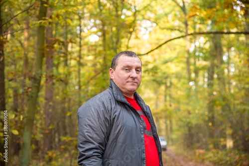 Man looking at the camera in the garden