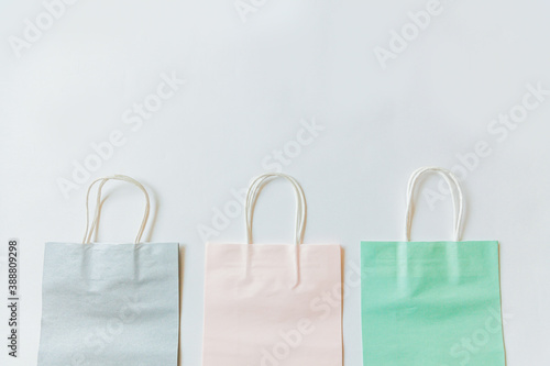 Simply minimal design three many shopping bag isolated on white background. Online or mall shopping shopaholic concept. Black friday Christmas season sale. Flat lay top view copy space mock up