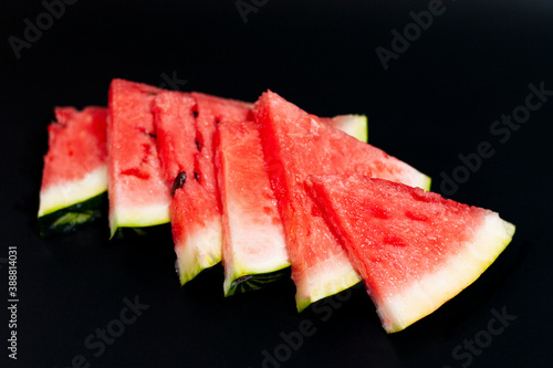 Watermelon slices located at the overlapping diagonally.