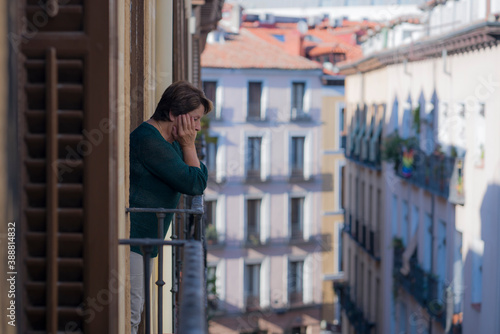dramatic lifestyle portrait of mature woman on her 70s depressed and sad at home balcony feeling desperate suffering anxiety problem in senior female depression concept © TheVisualsYouNeed