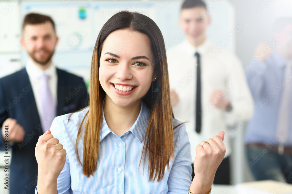 Smiling beauty businesswoman office portrait standing on group business peoples background. Demonstrates joy winning end reporting period education completion affairs and energy concept Smiling beauty businesswoman office portrait standing on group business peoples background. Demonstrates joy winning end reporting period education completion affairs and energy concept