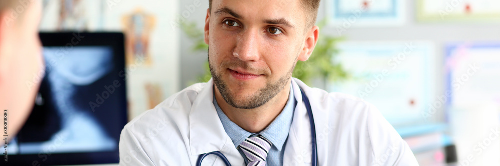 Portrait of man doc looking away with gladness. Professional having conversation with colleague about work. Male wearing white robe and striped tie. Medical treatment concept Portrait of man doc looking away with gladness. Professional having conversation with colleague about work. Male wearing white robe and striped tie. Medical treatment concept