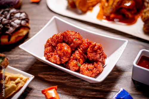 Photography Boneless Wings Shaken in Barbecue Sauce in White Plate
