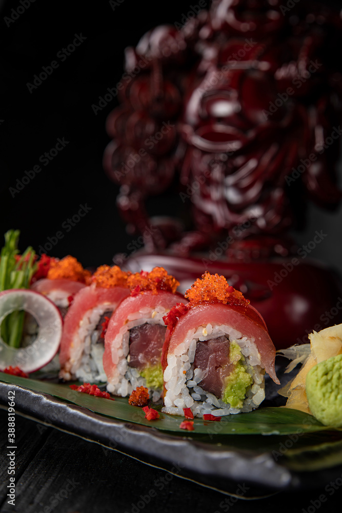 Japanese traditional rolls with tuna, caviar, on a dark table
Japanese traditional rolls with tuna, caviar, on a dark table