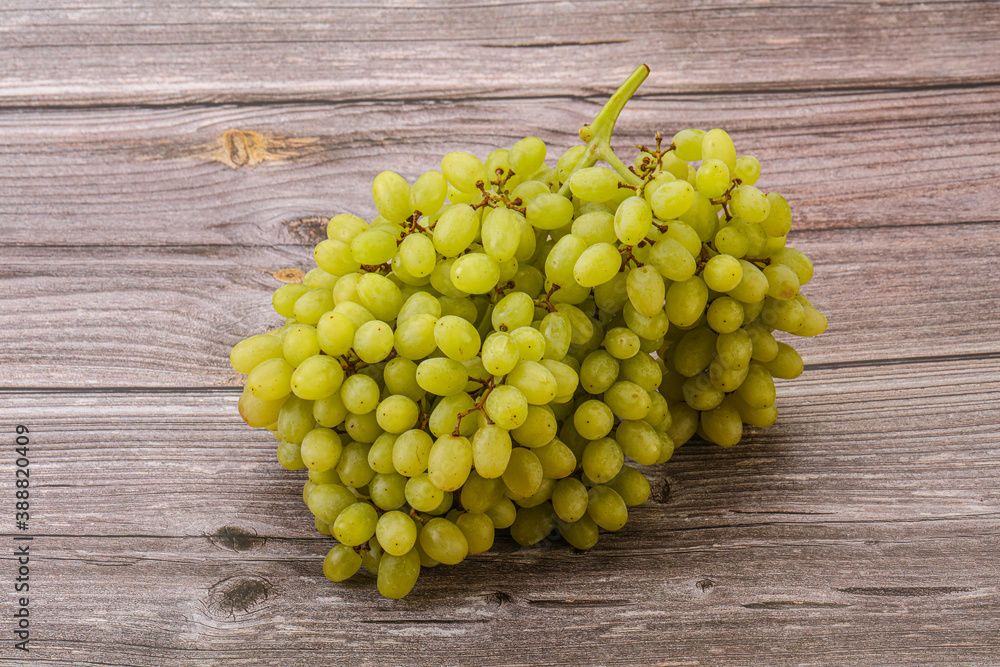 Green grape branch over background Green grape branch over background