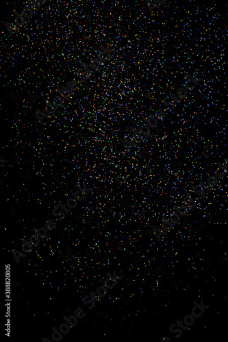 glitter sparkle powder background isolated on black background, star glitters background