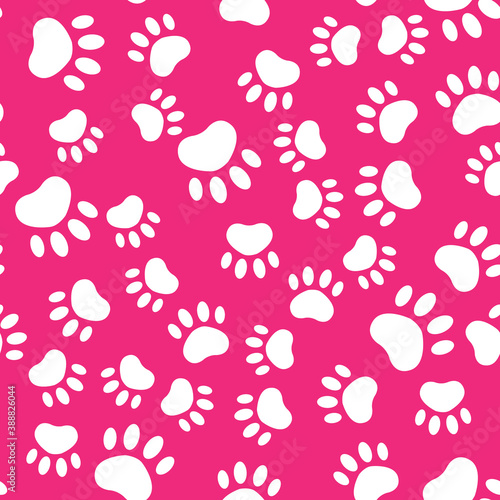 Seamless pattern with white cat paws on pink background.