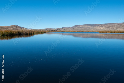 The deep blue calm waters of Duffurena Pond Number 20 at Sheldon National Wildlife Refuge in Washoe County  Nevada  USA