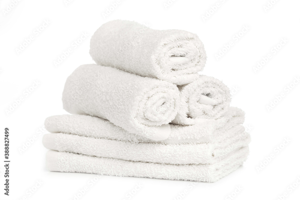 several white clean towels rolled up on a white background several white clean towels rolled up on a white background