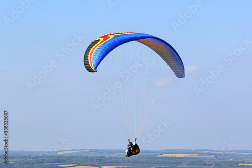Tandem Paraglider flying at Combe Gibbet, England 