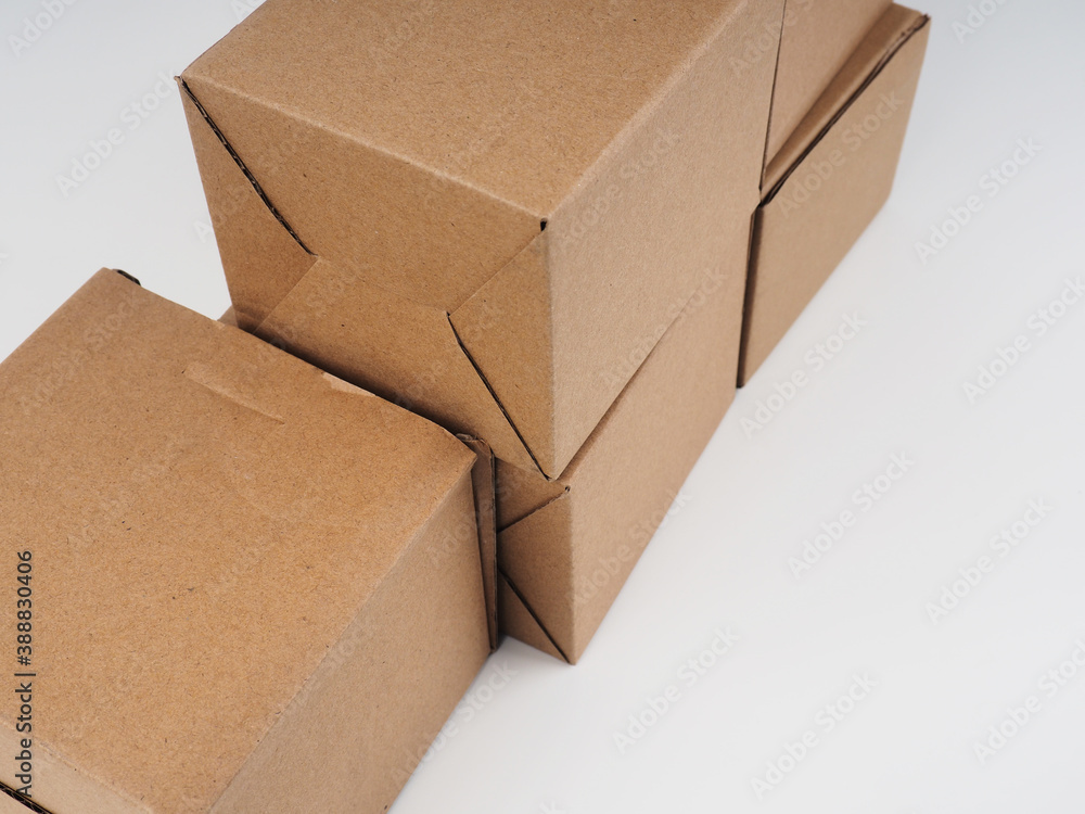 several cardboard boxes. Cardboard Boxes Stacked Against White Background several cardboard boxes. Cardboard Boxes Stacked Against White Background