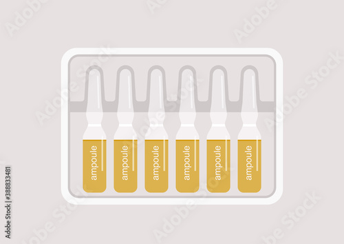 A set of glass ampoules in a plastic package, health care and vaccination, beauty treatment