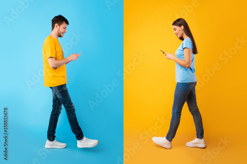 Portrait of young couple using their mobile phones