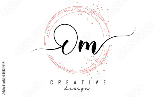 Handwritten Om O m letter logo with sparkling circles with pink glitter.