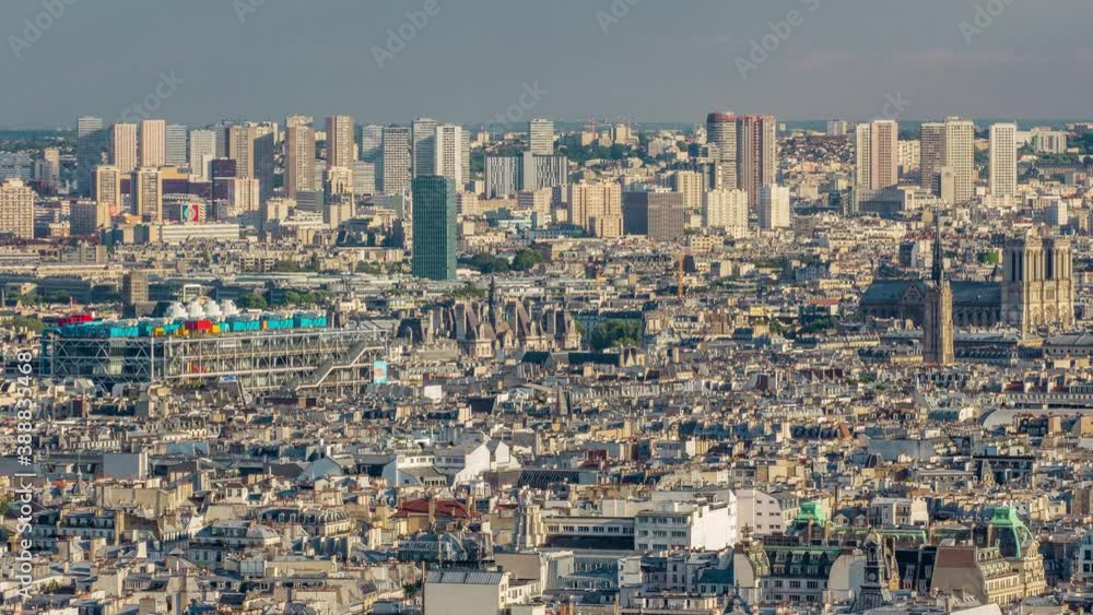 Panorama of Paris timelapse with Notre Dame de Paris, France. Top view from Sacred Heart Basilica of Montmartre (Sacre-Coeur). Sunny day with blue cloudy sky. Panorama of Paris timelapse with Notre Dame de Paris, France. Top view from Sacred Heart Basilica of Montmartre (Sacre-Coeur). Sunny day with blue cloudy sky.
