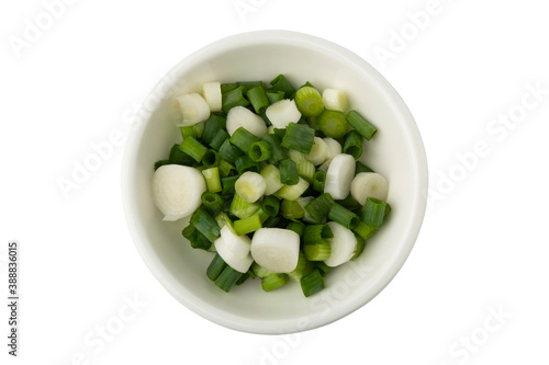 Chop spring onion in a white bowl isolated on white background with Clipping Path