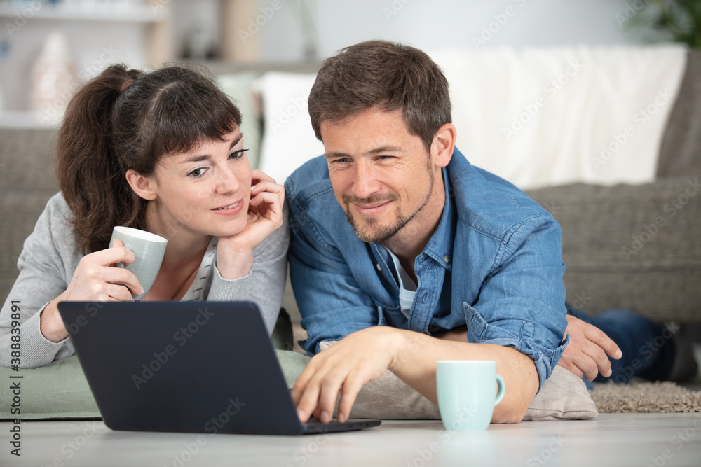 happy young couple online shopping at home happy young couple online shopping at home