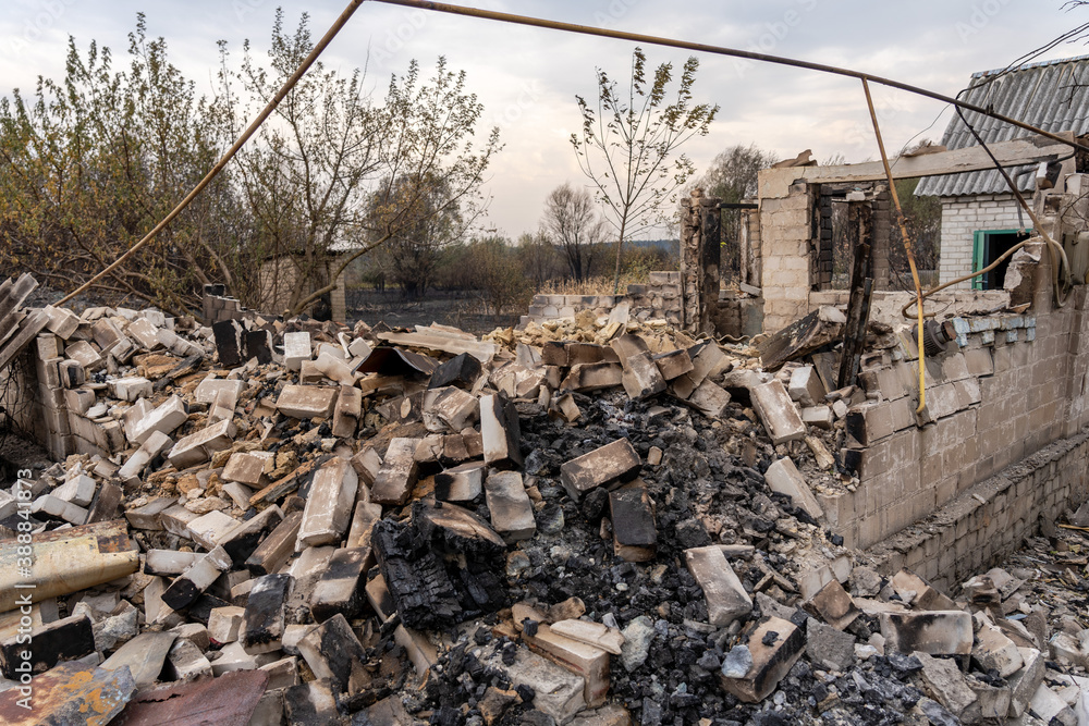 Pile of burnt bricks from a destroyed house after the fire Pile of burnt bricks from a destroyed house after the fire