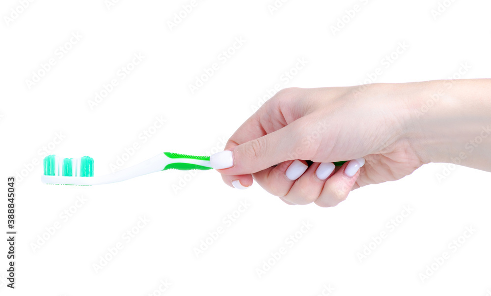 Green tooth brush in hand on white background isolation Green tooth brush in hand on white background isolation